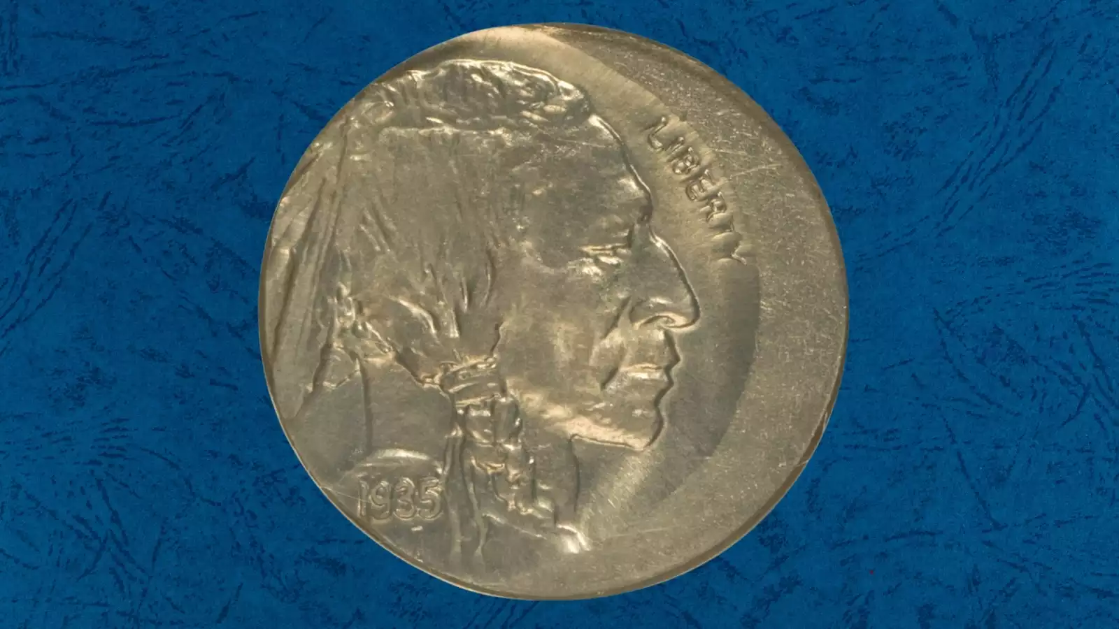 1935 Buffalo Nickel off-center strike error showing the design shifted with blank planchet visible on the edge